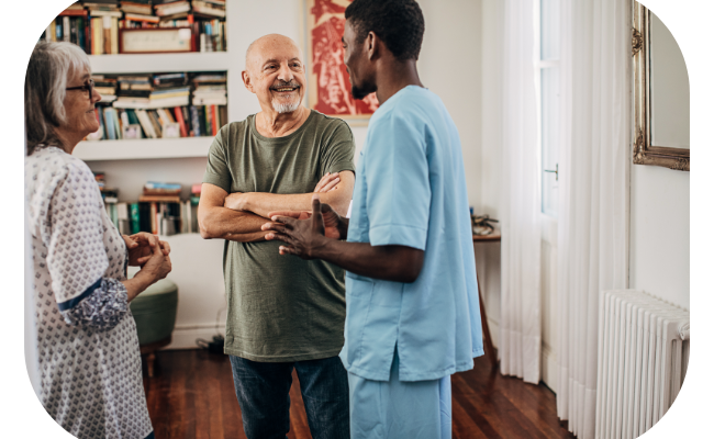 Image of a Universal Health Care Ottawa team member engaged in a conversation with a family interested in hiring Personal Support Workers (PSWs).